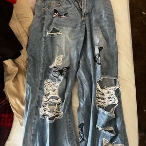 Blue butterfly ripped jeans